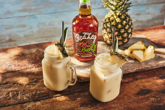 RedLeg Rum pina colada cocktails garnished with fresh pineapple